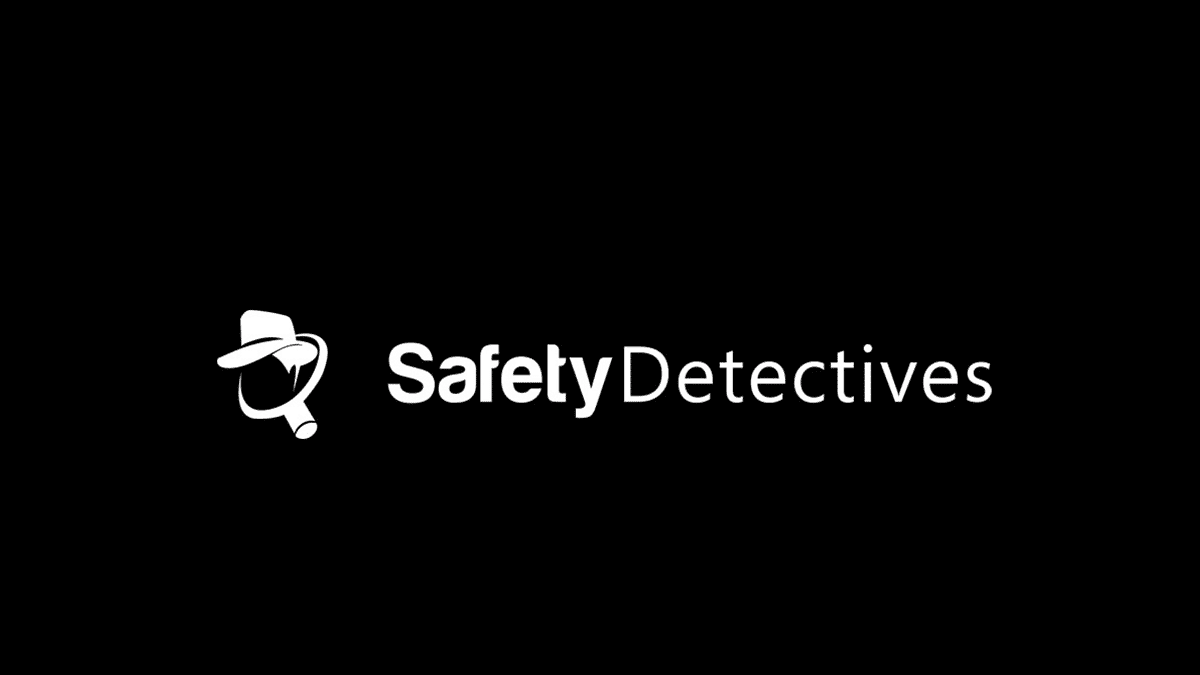 The image shows the logo for "Safety Detectives." It features a white magnifying glass with a stylized detective's hat in it, next to the text "SafetyDetectives" in white. The background is black.